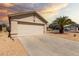 Attached two-car garage with a spacious driveway offers convenient parking and storage at 8502 W Pierson St, Phoenix, AZ 85037
