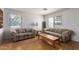 Inviting living area with hardwood floors and large windows creating a bright and airy atmosphere at 8502 W Pierson St, Phoenix, AZ 85037