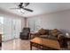 Inviting living area with tile flooring, ample seating, a cozy sofa and generous natural light at 8502 W Pierson St, Phoenix, AZ 85037