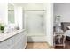 The bathroom features a sink with a walk-in shower adjacent to the main bedroom at 9167 N 73Rd Ln, Peoria, AZ 85345