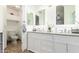 Bathroom with a double sink vanity and an enclosed toilet at 9167 N 73Rd Ln, Peoria, AZ 85345