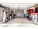 Garage with built in cabinets for extra storage and a variety of workout equipment at 9167 N 73Rd Ln, Peoria, AZ 85345