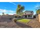 Spacious backyard with low-maintenance landscaping, turf area, and mature trees for shade at 920 E Leslie E Ave, San Tan Valley, AZ 85140