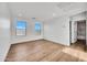 Bright, spacious bedroom features hardwood floors and large windows at 920 E Leslie E Ave, San Tan Valley, AZ 85140