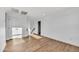 Bright bonus room with wood-look floors, white walls, recessed lighting, and staircase at 920 E Leslie E Ave, San Tan Valley, AZ 85140
