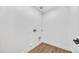 The laundry room features white walls and trim, wood-look floors, and washer/dryer hookups at 920 E Leslie E Ave, San Tan Valley, AZ 85140
