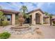 Beautifully landscaped clubhouse featuring a serene fountain, lush greenery, and desert landscaping at 9451 E Becker Ln # 2004, Scottsdale, AZ 85260