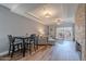 Bright living room features wood floors, fireplace, and a dining area at 9451 E Becker Ln # 2004, Scottsdale, AZ 85260