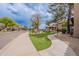 Beautiful street view with landscaped sidewalks, mature trees, and well maintained apartments at 9451 E Becker Ln # 2004, Scottsdale, AZ 85260