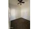 Cozy bedroom featuring neutral carpet, ample space, and a ceiling fan at 10247 W Hilton Ave, Tolleson, AZ 85353