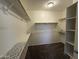 Walk-in closet with shelving provides ample storage and organization options at 10247 W Hilton Ave, Tolleson, AZ 85353