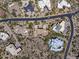 An aerial view showcases a desert neighborhood with luxury homes and lush landscaping at 10283 E Running Deer Trl, Scottsdale, AZ 85262