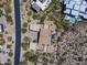 An aerial view captures a desert home with a patio and a swimming pool at 10283 E Running Deer Trl, Scottsdale, AZ 85262