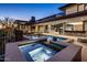 Luxury backyard with a pool, spa, and outdoor living space, perfect for relaxation and entertainment at 10283 E Running Deer Trl, Scottsdale, AZ 85262