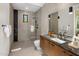 Modern bathroom featuring a glass-enclosed shower and a sleek vanity with a black marble countertop at 10283 E Running Deer Trl, Scottsdale, AZ 85262