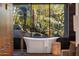 Contemporary bathroom featuring a free-standing tub and scenic desert views at 10283 E Running Deer Trl, Scottsdale, AZ 85262