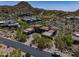 A modern, desert home features angular architecture, desert landscaping, and majestic mountain views at 10283 E Running Deer Trl, Scottsdale, AZ 85262