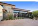 Beautiful home featuring desert landscaping, architectural stone accents, and a unique water feature at 10283 E Running Deer Trl, Scottsdale, AZ 85262