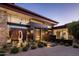 Striking modern home featuring a unique water feature and desert landscaping at the front entrance at 10283 E Running Deer Trl, Scottsdale, AZ 85262