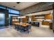 Open concept kitchen and dining room with stone accent walls and modern finishes throughout at 10283 E Running Deer Trl, Scottsdale, AZ 85262