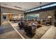 Spacious living room flows into dining and kitchen area, with large windows offering ample natural light at 10283 E Running Deer Trl, Scottsdale, AZ 85262