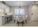 Bright dining area connected to the kitchen, featuring a glass-top table and comfortable chairs at 12222 N Paradise Vlg S Pkwy # 237, Phoenix, AZ 85032