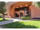 Impressive building entrance featuring unique architectural design with arched openings and large windows at 12222 N Paradise Vlg S Pkwy # 237, Phoenix, AZ 85032