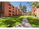 Serene paved path winding through lush landscaping, enhanced by mature trees, a scenic stroll at 12222 N Paradise Vlg S Pkwy # 237, Phoenix, AZ 85032