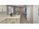 Bright kitchen features white cabinets, quartz countertops, stainless appliances, and breakfast nook at 12222 N Paradise Vlg S Pkwy # 237, Phoenix, AZ 85032