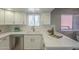 Modern kitchen featuring white countertops, stainless steel appliances, and contemporary fixtures at 12222 N Paradise Vlg S Pkwy # 237, Phoenix, AZ 85032