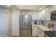 Bright kitchen offers white cabinets, quartz countertops, and stainless steel appliances at 12222 N Paradise Vlg S Pkwy # 237, Phoenix, AZ 85032