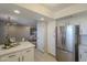 Bright kitchen showcases white cabinets, stainless appliances, and breakfast nook at 12222 N Paradise Vlg S Pkwy # 237, Phoenix, AZ 85032