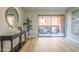 Bright living room featuring light wood floors, modern decor, and a sliding glass door to outdoor patio at 12222 N Paradise Vlg S Pkwy # 237, Phoenix, AZ 85032