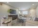 Inviting living room with a cozy seating area, modern TV, and adjacent dining space at 12222 N Paradise Vlg S Pkwy # 237, Phoenix, AZ 85032
