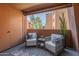 Cozy outdoor patio featuring comfortable seating and views of the surrounding community at 12222 N Paradise Vlg S Pkwy # 237, Phoenix, AZ 85032
