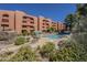 Resort-style pool area with cascading waterfall feature, surrounded by comfortable seating for relaxation at 12222 N Paradise Vlg S Pkwy # 237, Phoenix, AZ 85032