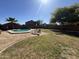 The expansive backyard features a pool, lounge chairs, and is perfect for outdoor living and entertaining at 12571 W Clarendon Ave, Avondale, AZ 85392