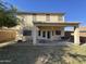 Expansive backyard featuring a covered patio for relaxing and ample space for outdoor activities and entertaining at 12571 W Clarendon Ave, Avondale, AZ 85392