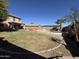 Spacious backyard with a pool and covered patio at 12571 W Clarendon Ave, Avondale, AZ 85392