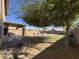 Large grassy backyard with mature tree and pool at 12571 W Clarendon Ave, Avondale, AZ 85392