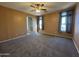 Large bedroom with plush carpet flooring, neutral walls, and natural light at 12571 W Clarendon Ave, Avondale, AZ 85392