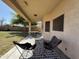 Backyard covered patio with patio furniture at 12571 W Clarendon Ave, Avondale, AZ 85392