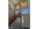Bright entryway featuring high ceilings, attractive light fixture, and views to the second story windows at 12571 W Clarendon Ave, Avondale, AZ 85392