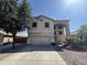 Charming two-story home with a neutral stucco exterior, a spacious two-car garage and low maintenance desert landscaping at 12571 W Clarendon Ave, Avondale, AZ 85392