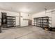 Garage with storage shelves and concrete flooring at 12571 W Clarendon Ave, Avondale, AZ 85392