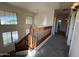 Bright hallway featuring carpet flooring and views of windows providing natural light at 12571 W Clarendon Ave, Avondale, AZ 85392