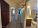 Hallway with carpet flooring and access to bedrooms and a bathroom at 12571 W Clarendon Ave, Avondale, AZ 85392