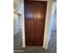 Hallway closet with brown doors and white trim at 12571 W Clarendon Ave, Avondale, AZ 85392