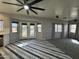 Open living space flowing to a patio with a pool view and tile flooring at 12571 W Clarendon Ave, Avondale, AZ 85392