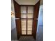 Open closet with empty shelves and brown doors at 12571 W Clarendon Ave, Avondale, AZ 85392